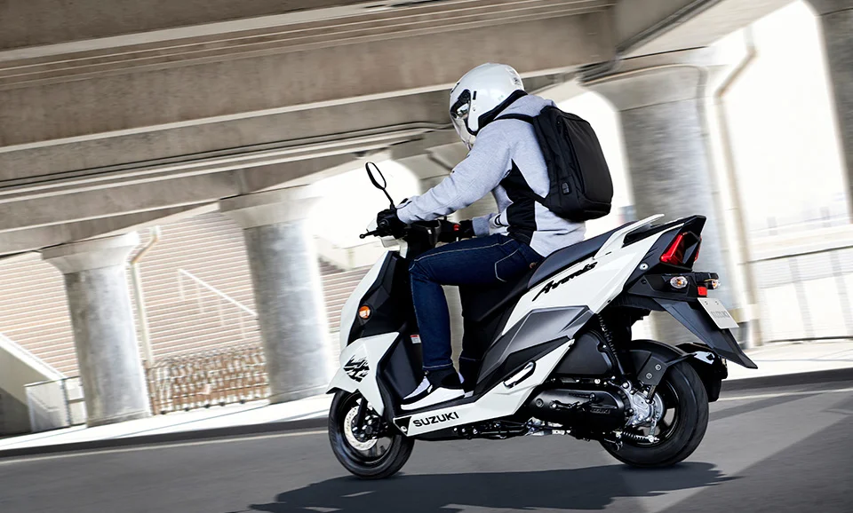 People Ride Suzuki Avenis 125 White Left Side